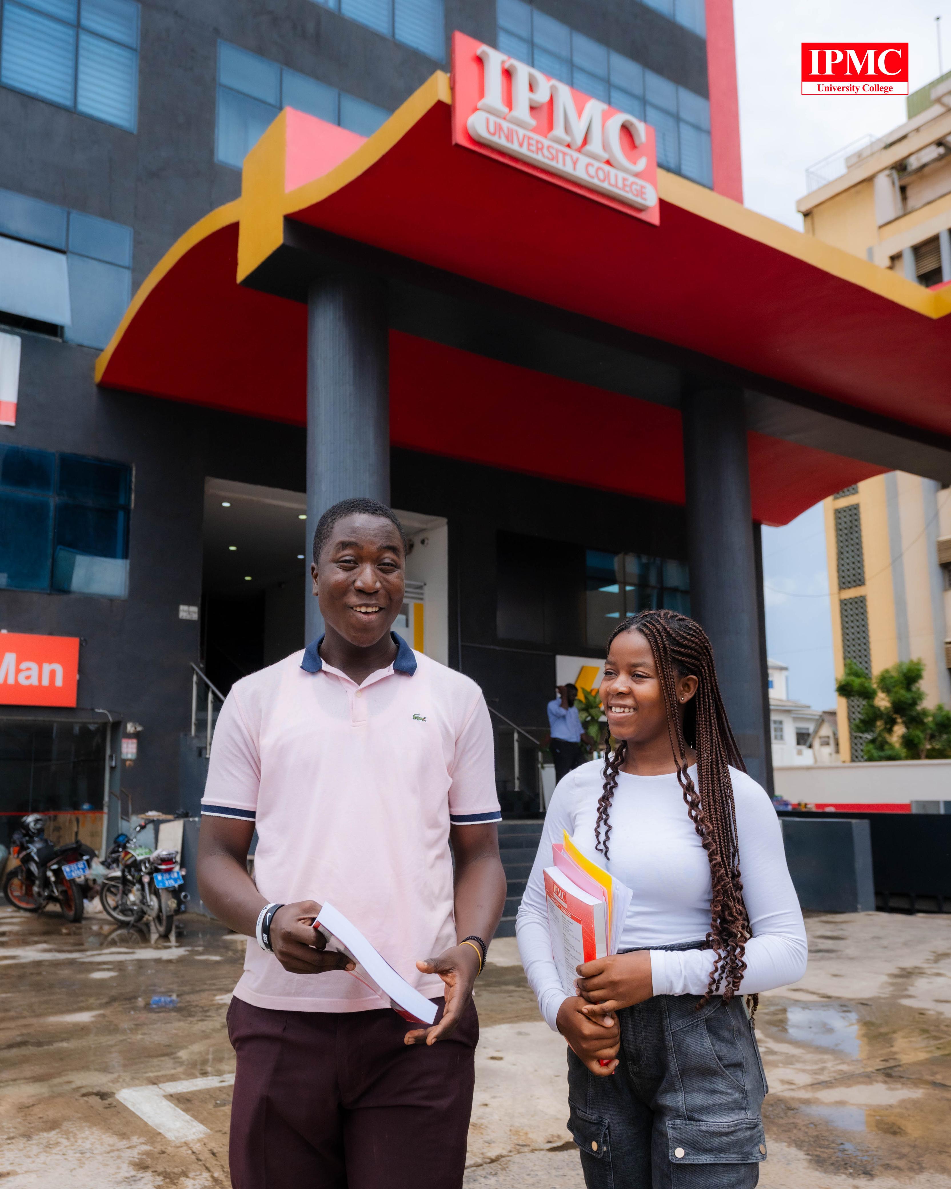 Two students outside the modern IPMC University College campus