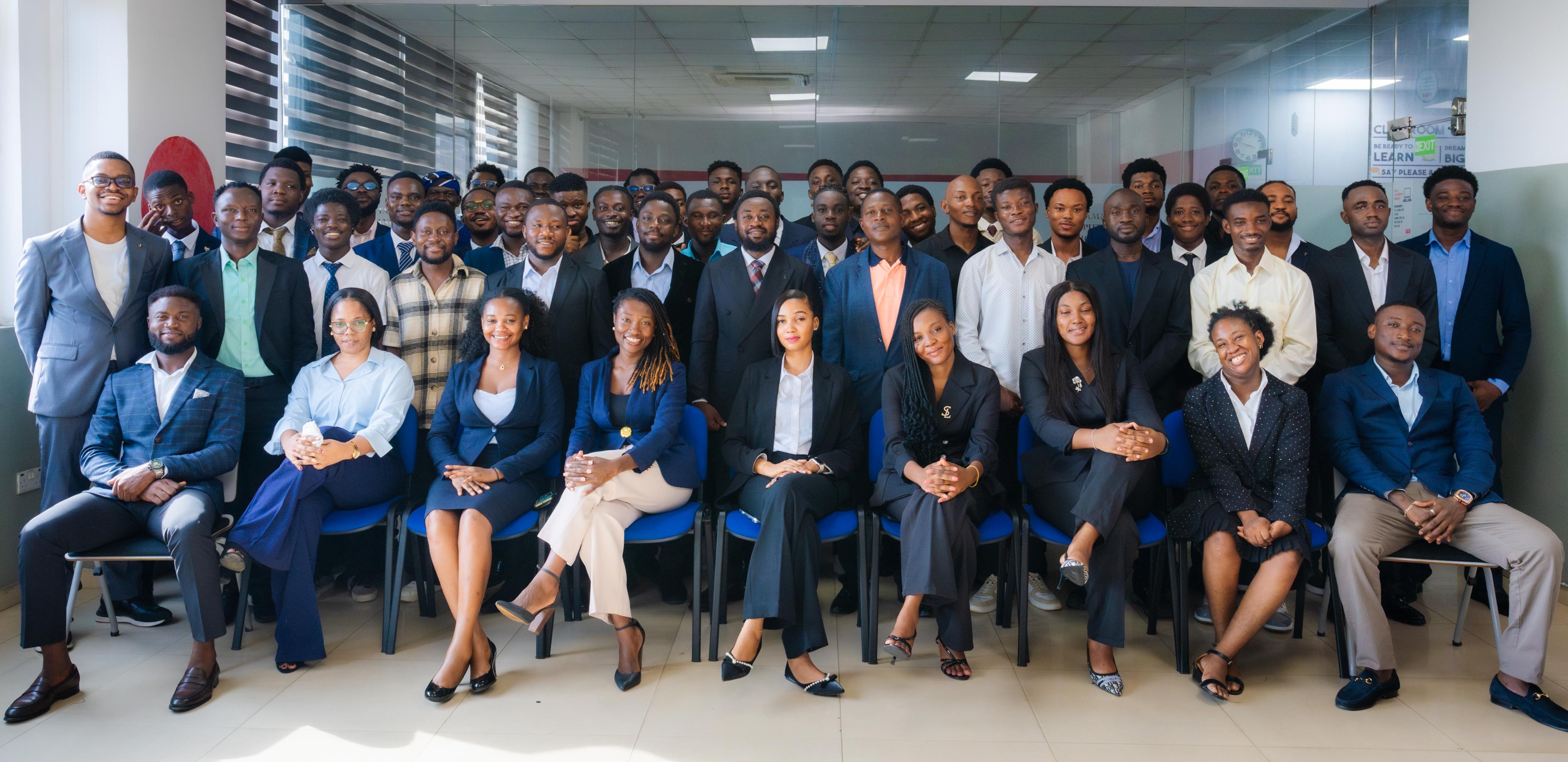 A cohort of IPMC students together in a modern classroom