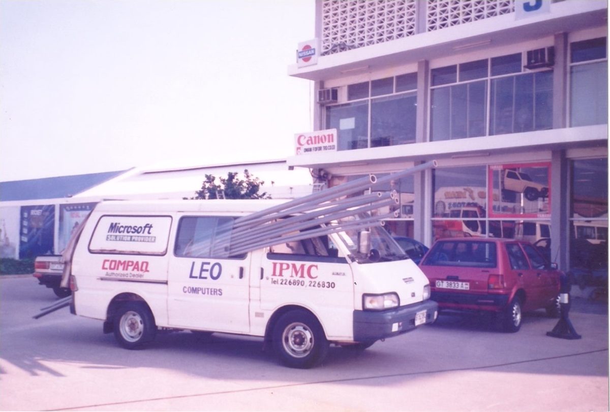 IPMC's first vehicle, a delivery van outside the office